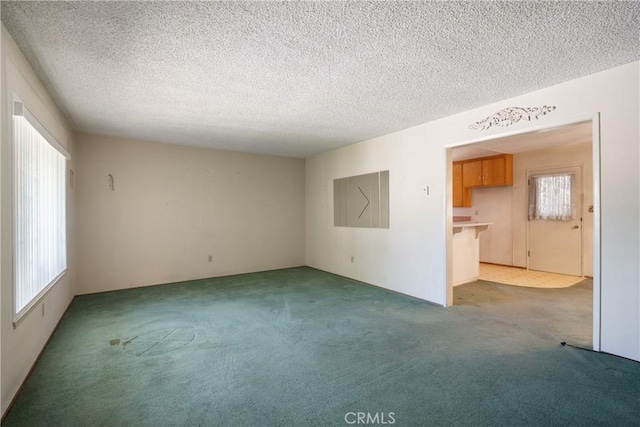 1359 W I St, Ontario, CA 91762 - carpeted spare room featuring a textured ceiling
