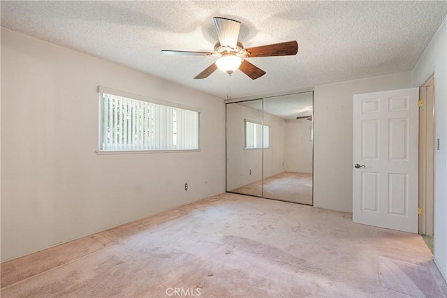 1359 W I St, Ontario, CA 91762 - unfurnished bedroom with carpet flooring, a textured ceiling, a closet, and a ceiling fan