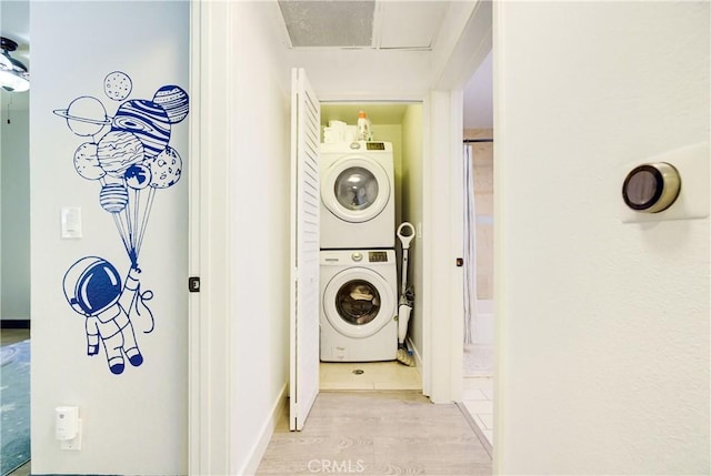 525 S Berendo St Unit 212, Los Angeles, CA 90020 - laundry area featuring estacked washer and dryer and light wood-type flooring