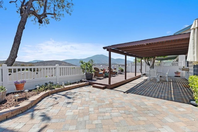 10879 Charing Cross Rd, Spring Valley, CA 91978 - fenced backyard featuring a deck with mountain view and a patio area