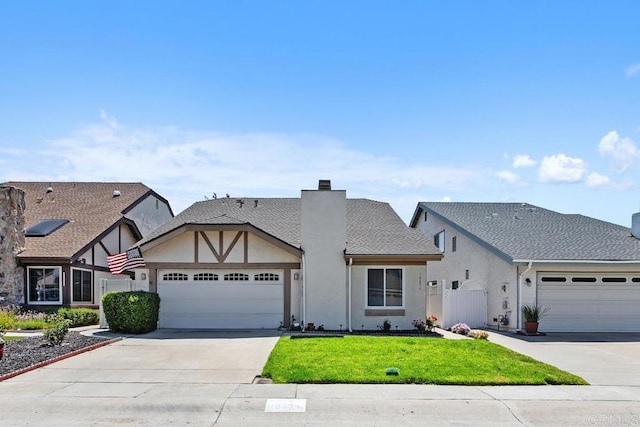 10879 Charing Cross Rd, Spring Valley, CA 91978 - view of front of property featuring an attached garage, a chimney, driveway, a front yard, and stucco siding
