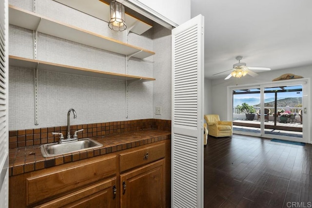 10879 Charing Cross Rd, Spring Valley, CA 91978 - kitchen with tile countertops, tasteful backsplash, ceiling fan, dark wood-style flooring, and open shelves