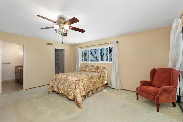 10879 Charing Cross Rd, Spring Valley, CA 91978 - bedroom with light colored carpet, ceiling fan, and connected bathroom