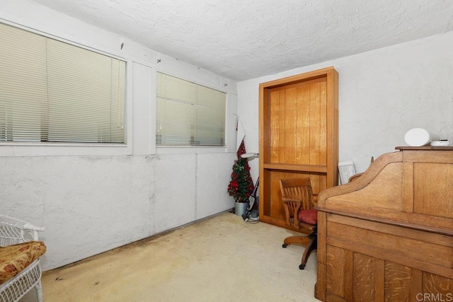 10879 Charing Cross Rd, Spring Valley, CA 91978 - carpeted home office featuring a textured ceiling