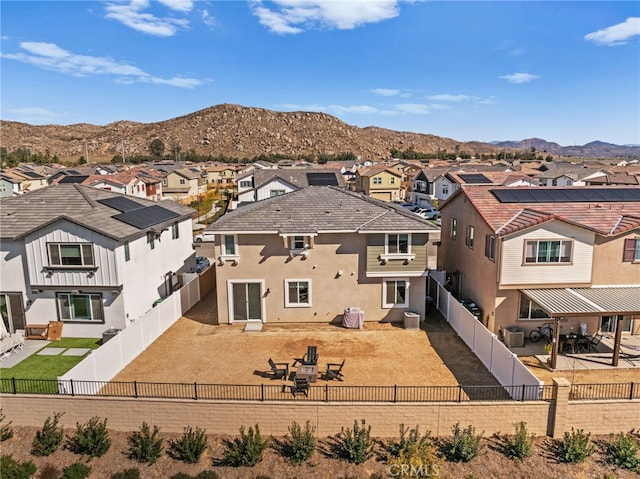 30181 Adrift Ln, Menifee, CA 92584 - rear view of property featuring a residential view, stucco siding, a mountain view, and a fenced backyard