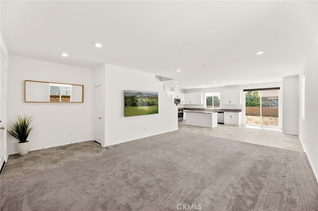30181 Adrift Ln, Menifee, CA 92584 - unfurnished living room featuring light colored carpet and recessed lighting
