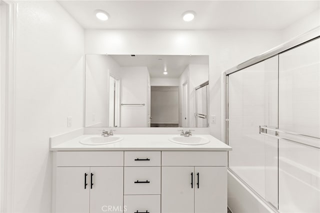 30181 Adrift Ln, Menifee, CA 92584 - bathroom featuring double vanity and bath / shower combo with glass door