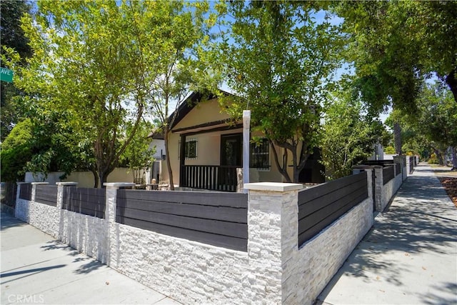 77 W Washington Blvd, Pasadena, CA 91103 - view of front of home with a fenced front yard and stucco siding