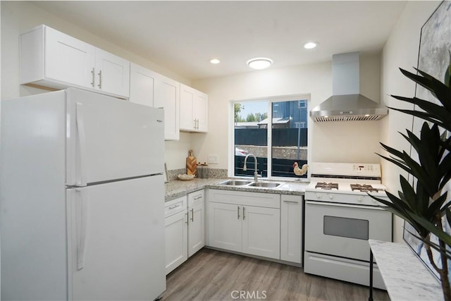77 W Washington Blvd, Pasadena, CA 91103 - kitchen featuring white appliances, wall chimney exhaust hood, white cabinetry, wood finished floors, and recessed lighting