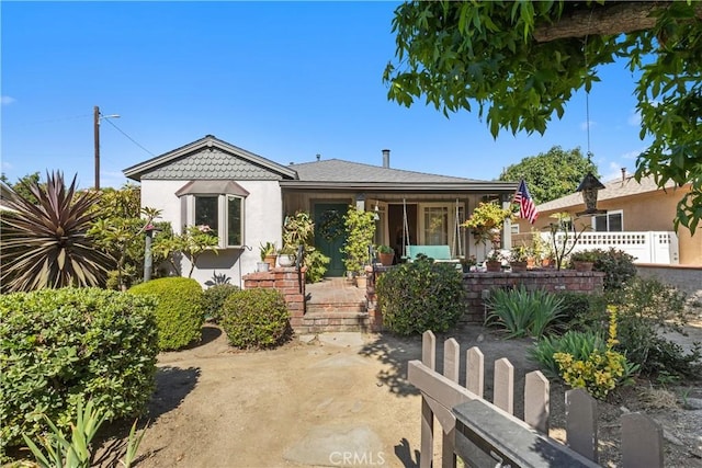 719 S Amstutz Ave, Anaheim, CA 92802 - view of front of property featuring stucco siding and covered porch