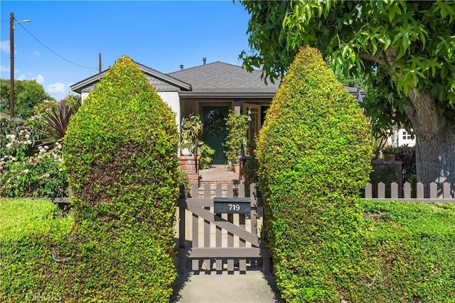 719 S Amstutz Ave, Anaheim, CA 92802 - obstructed view of property featuring roof with shingles