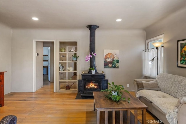 719 S Amstutz Ave, Anaheim, CA 92802 - living area featuring a wood stove, light wood-style flooring, and recessed lighting