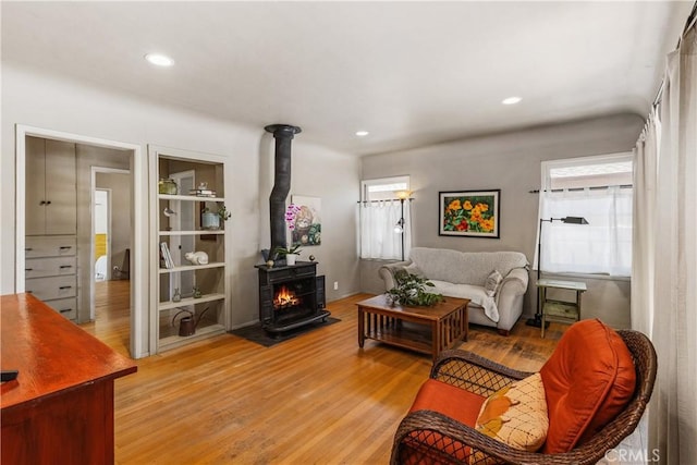 719 S Amstutz Ave, Anaheim, CA 92802 - living room with light wood-type flooring, a wood stove, and recessed lighting