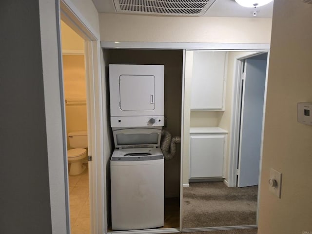 18680 Caminito Cantilena Unit 230, San Diego, CA 92128 - washroom with stacked washer / dryer