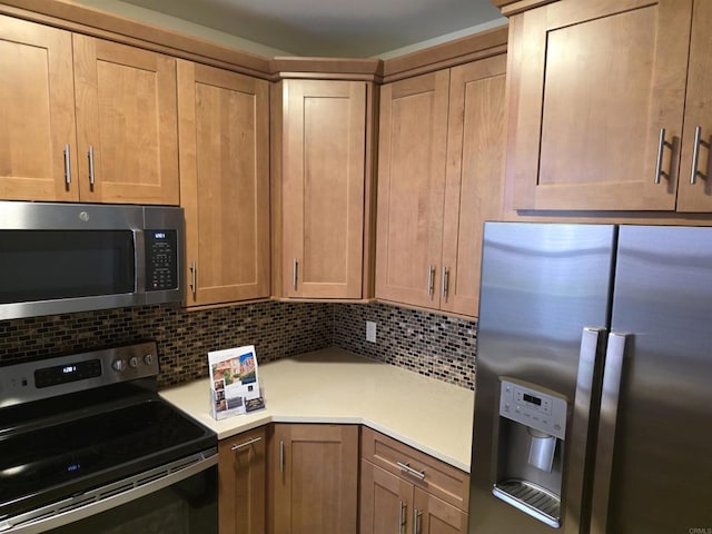 18680 Caminito Cantilena Unit 230, San Diego, CA 92128 - kitchen with stainless steel appliances, light countertops, and backsplash