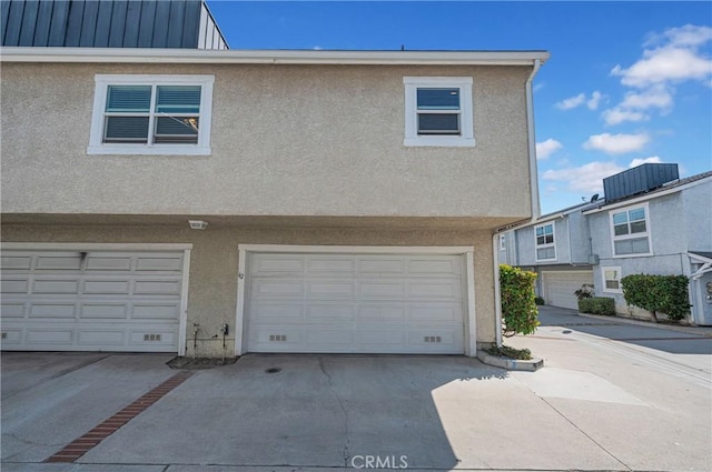 13303 Waco St Unit 62, Baldwin Park, CA 91706 - garage featuring concrete driveway