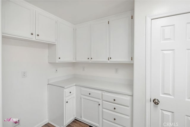 kitchen featuring white cabinetry and light countertops
