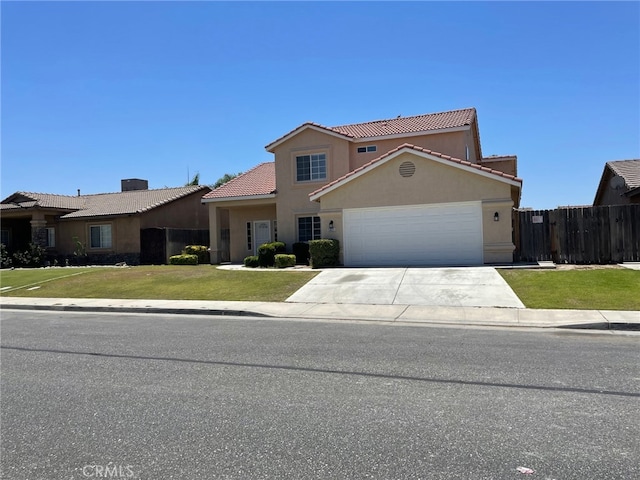 view of front of home featuring a tiled roof, stucco siding, driveway, and an attached garage