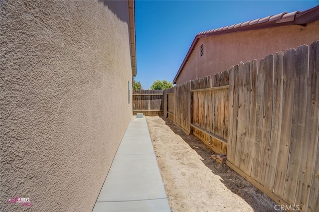 view of side of home with stucco siding