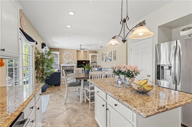 1555 Lupine Cir, Corona, CA 92881 - kitchen with stainless steel fridge, open floor plan, white cabinetry, and recessed lighting