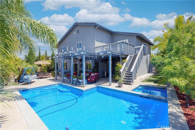 1555 Lupine Cir, Corona, CA 92881 - view of swimming pool with stairs, a deck, a pergola, a pool with connected hot tub, and a patio