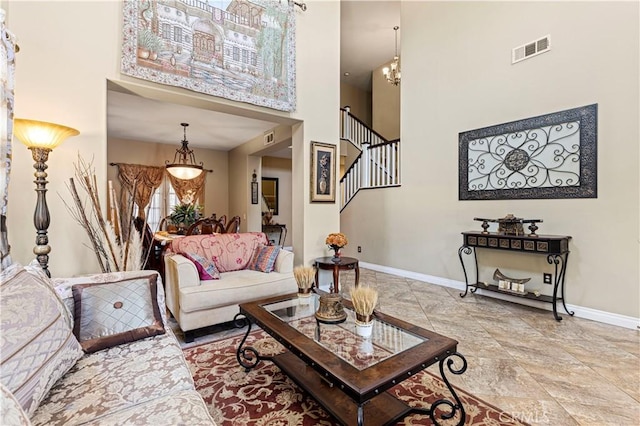 1555 Lupine Cir, Corona, CA 92881 - living area with a towering ceiling, stairway, and a chandelier