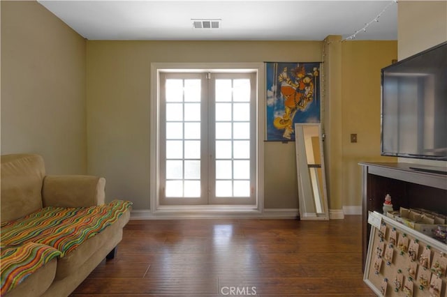 1555 Lupine Cir, Corona, CA 92881 - sitting room featuring healthy amount of natural light and dark wood-style floors