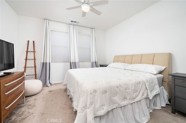 16502 Casa Grande Ave Unit 102, Fontana, CA 92336 - bedroom featuring light colored carpet, vaulted ceiling, and a ceiling fan