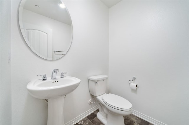 16502 Casa Grande Ave Unit 102, Fontana, CA 92336 - bathroom with baseboards and toilet