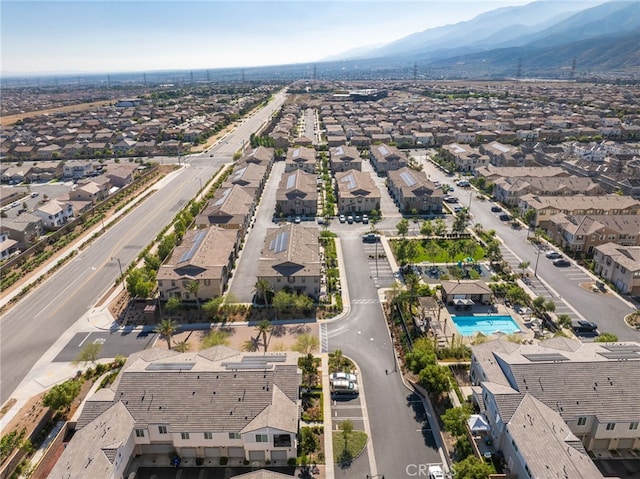 16502 Casa Grande Ave Unit 102, Fontana, CA 92336 - aerial perspective of suburban area with a mountain backdrop and a pool area