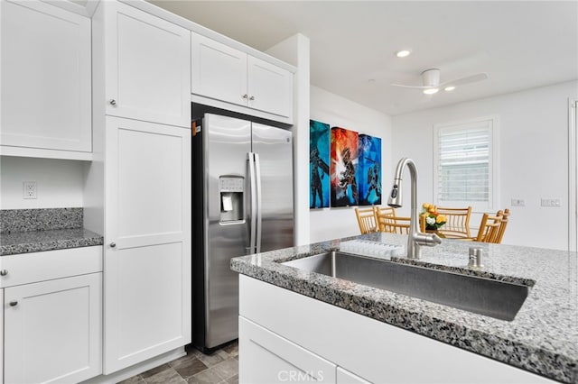 16502 Casa Grande Ave Unit 102, Fontana, CA 92336 - kitchen featuring stainless steel fridge with ice dispenser, white cabinets, dark stone countertops, recessed lighting, and ceiling fan
