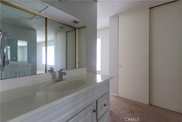 6186 Hefley St Unit 13, Westminster, CA 92683 - bathroom featuring vanity and a textured ceiling