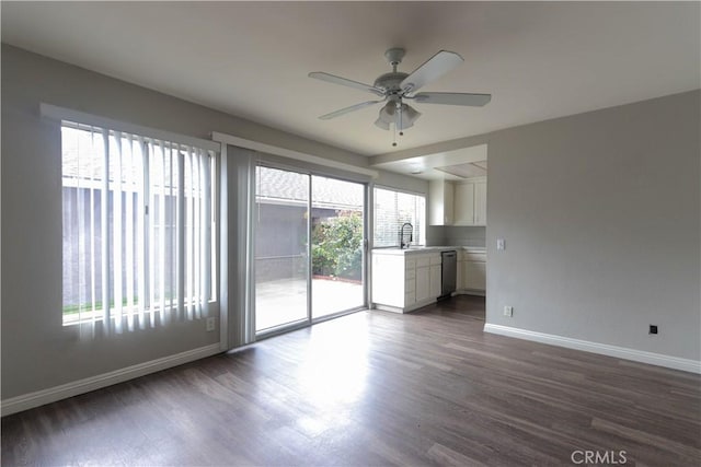 6186 Hefley St Unit 13, Westminster, CA 92683 - unfurnished living room featuring a ceiling fan and dark wood finished floors