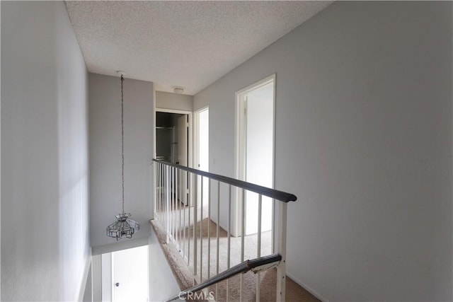 6186 Hefley St Unit 13, Westminster, CA 92683 - stairs featuring a textured ceiling and carpet