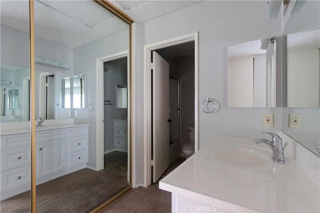 6186 Hefley St Unit 13, Westminster, CA 92683 - bathroom featuring vanity and a textured ceiling