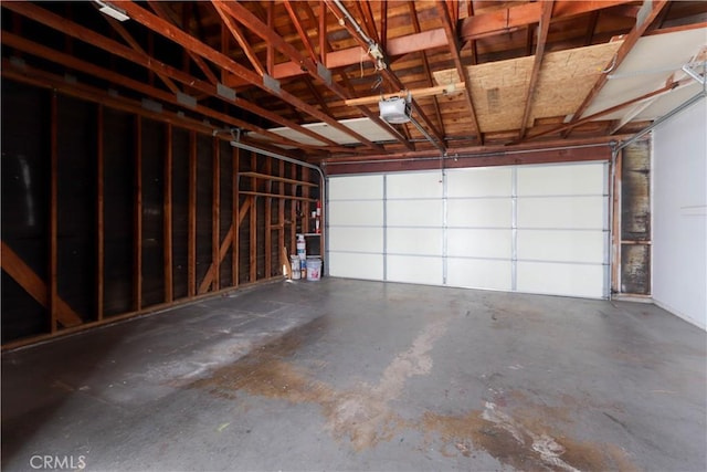 6186 Hefley St Unit 13, Westminster, CA 92683 - garage featuring a garage door opener