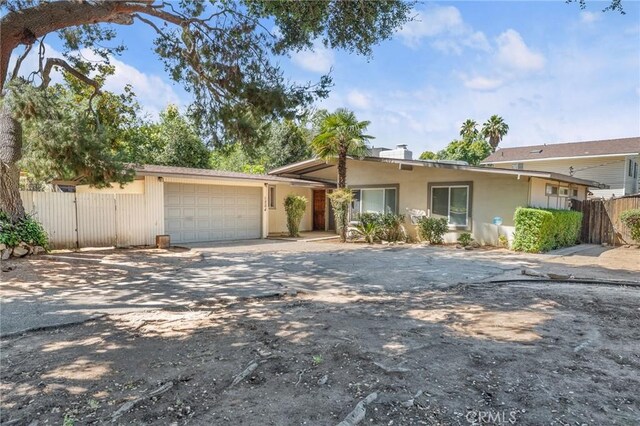 1204 San Jacinto, Redlands, CA 92373 - single story home with a garage, driveway, stucco siding, and a gate
