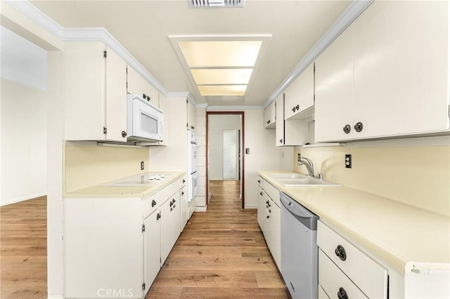 1204 San Jacinto, Redlands, CA 92373 - kitchen with white appliances, light wood-type flooring, light countertops, and white cabinetry
