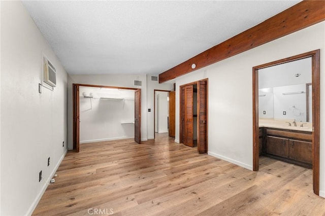 1204 San Jacinto, Redlands, CA 92373 - unfurnished bedroom featuring light wood-style flooring, multiple closets, and ensuite bathroom