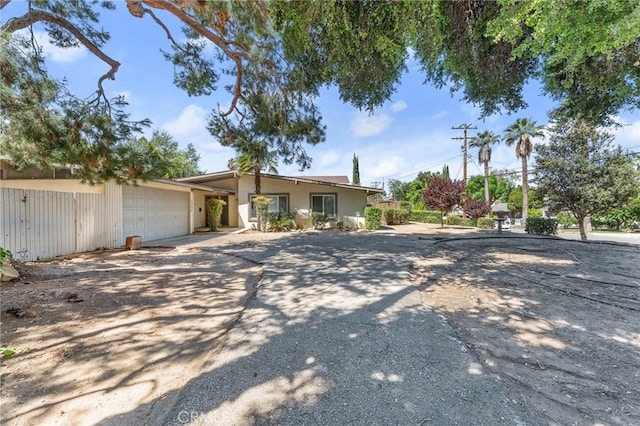 1204 San Jacinto, Redlands, CA 92373 - view of front facade featuring an attached garage, driveway, and stucco siding