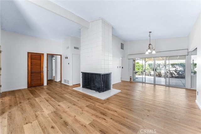 1204 San Jacinto, Redlands, CA 92373 - unfurnished living room featuring high vaulted ceiling, light wood finished floors, a fireplace, a chandelier, and beam ceiling