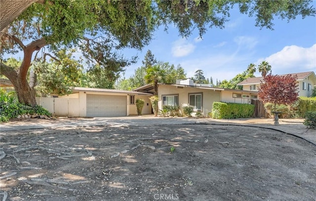 1204 San Jacinto, Redlands, CA 92373 - view of front facade with a garage, stucco siding, and concrete driveway