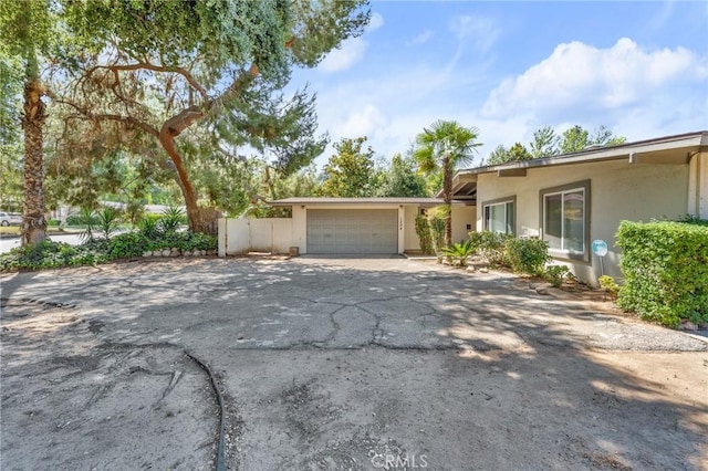 1204 San Jacinto, Redlands, CA 92373 - view of front facade with stucco siding, an attached garage, and driveway