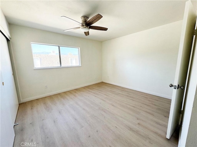 25180 5th St Unit 213, San Bernardino, CA 92410 - unfurnished bedroom featuring wood finished floors, ceiling fan, and a closet
