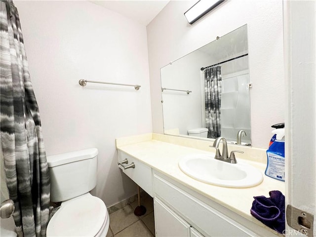 25180 5th St Unit 213, San Bernardino, CA 92410 - bathroom featuring tile patterned floors, vanity, and a shower with curtain