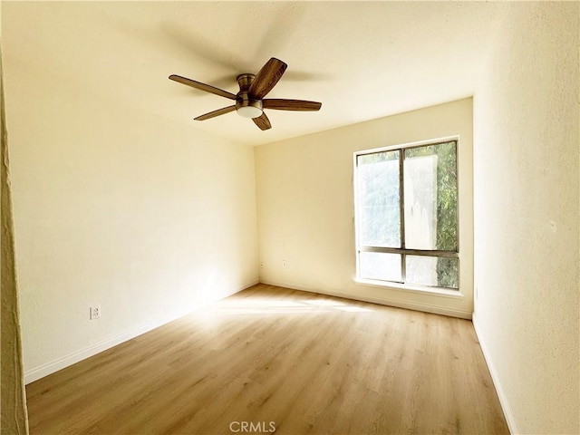 25180 5th St Unit 213, San Bernardino, CA 92410 - spare room featuring light wood-style flooring and a ceiling fan