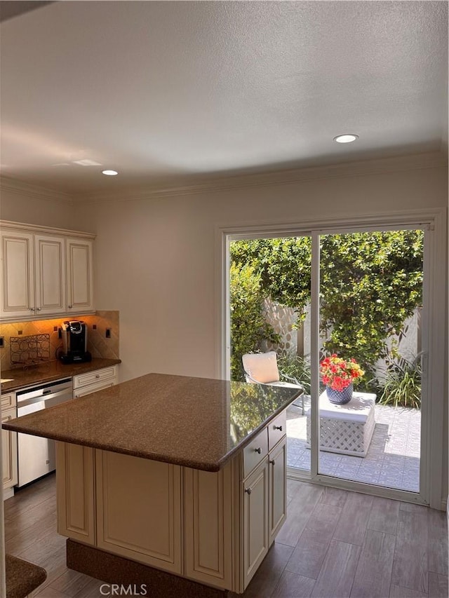 44 Arcata, Irvine, CA 92602 - kitchen with stainless steel dishwasher, healthy amount of natural light, cream cabinets, crown molding, and recessed lighting