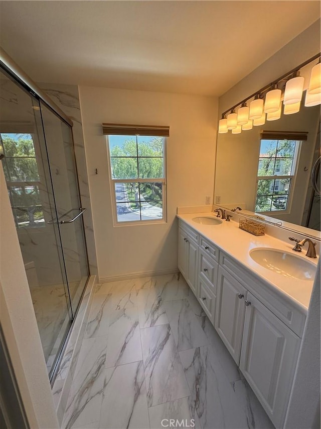 44 Arcata, Irvine, CA 92602 - bathroom with healthy amount of natural light, double vanity, and a marble finish shower