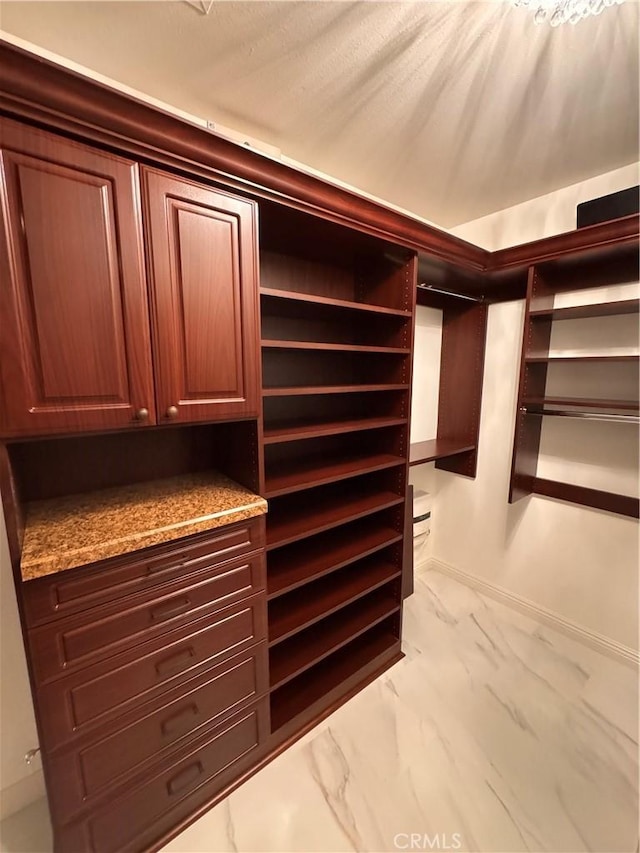 44 Arcata, Irvine, CA 92602 - walk in closet with marble look tile flooring