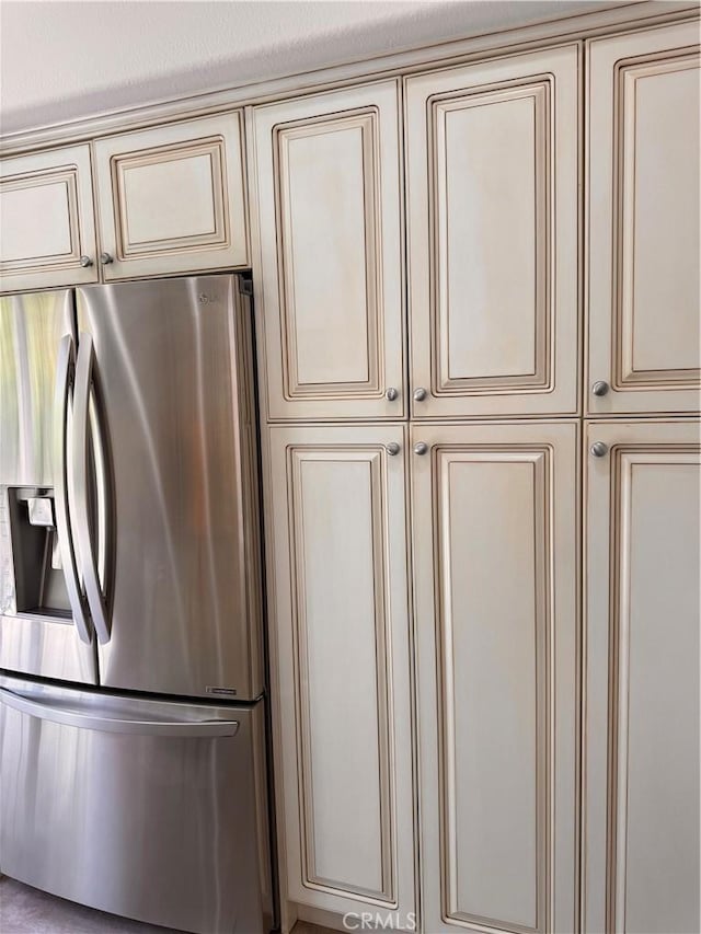 44 Arcata, Irvine, CA 92602 - kitchen view of cream cabinetry and stainless steel fridge